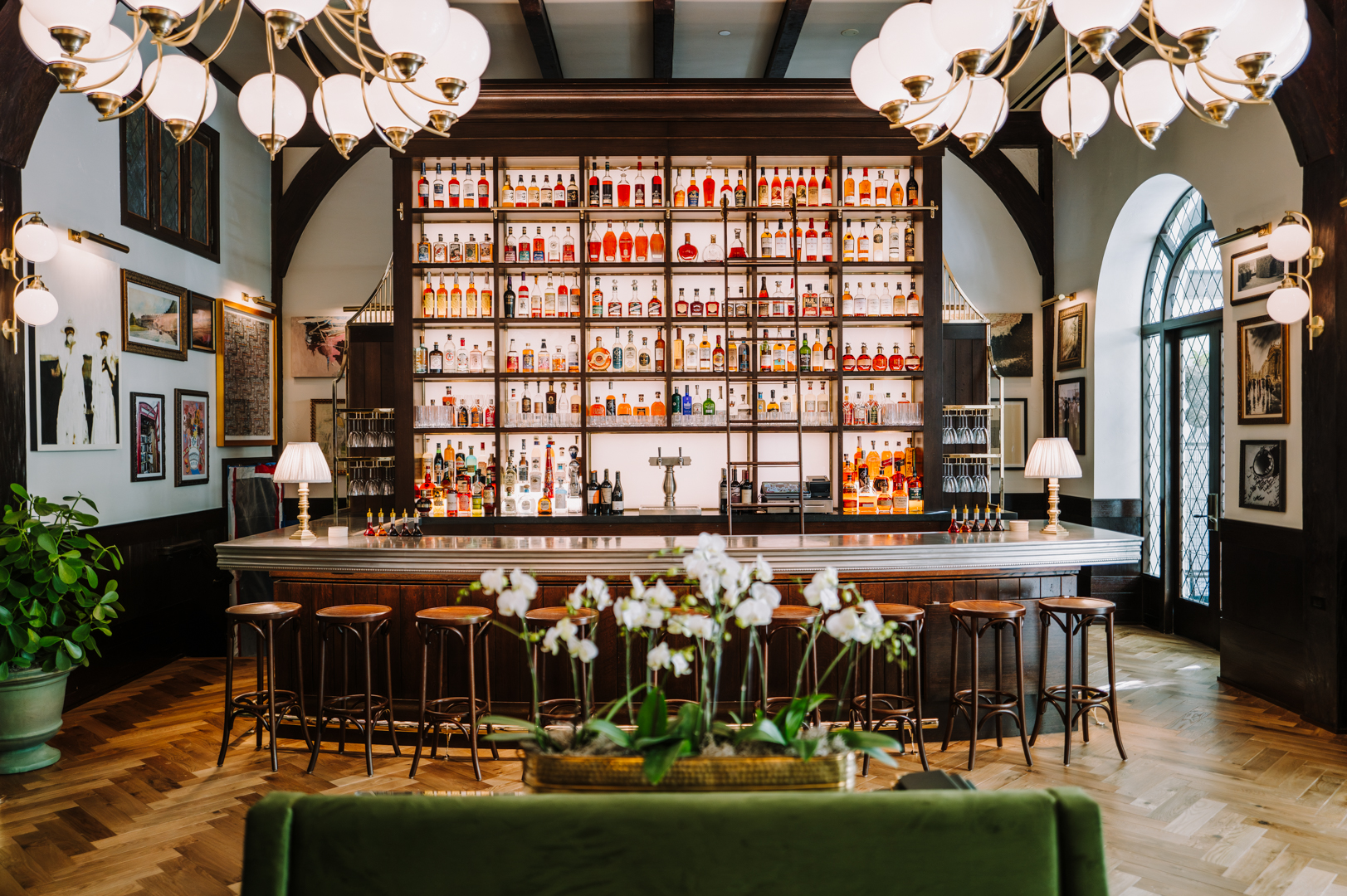 a bar with shelves of liquor bottles