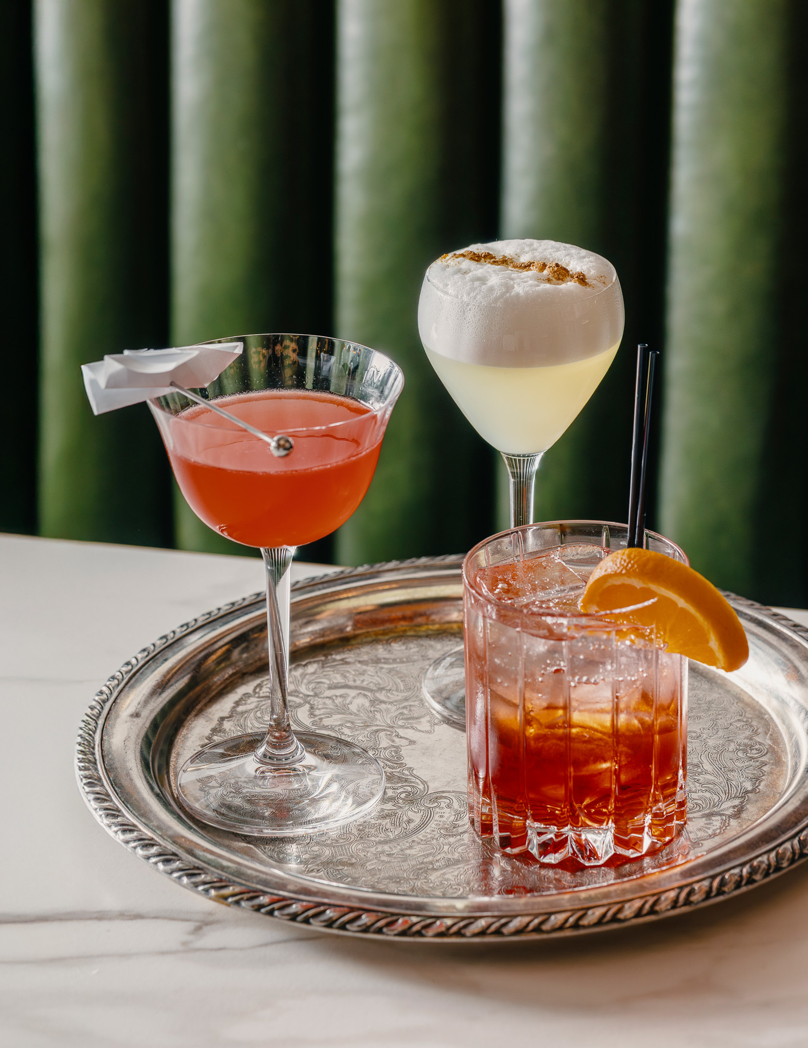 a group of drinks on a tray