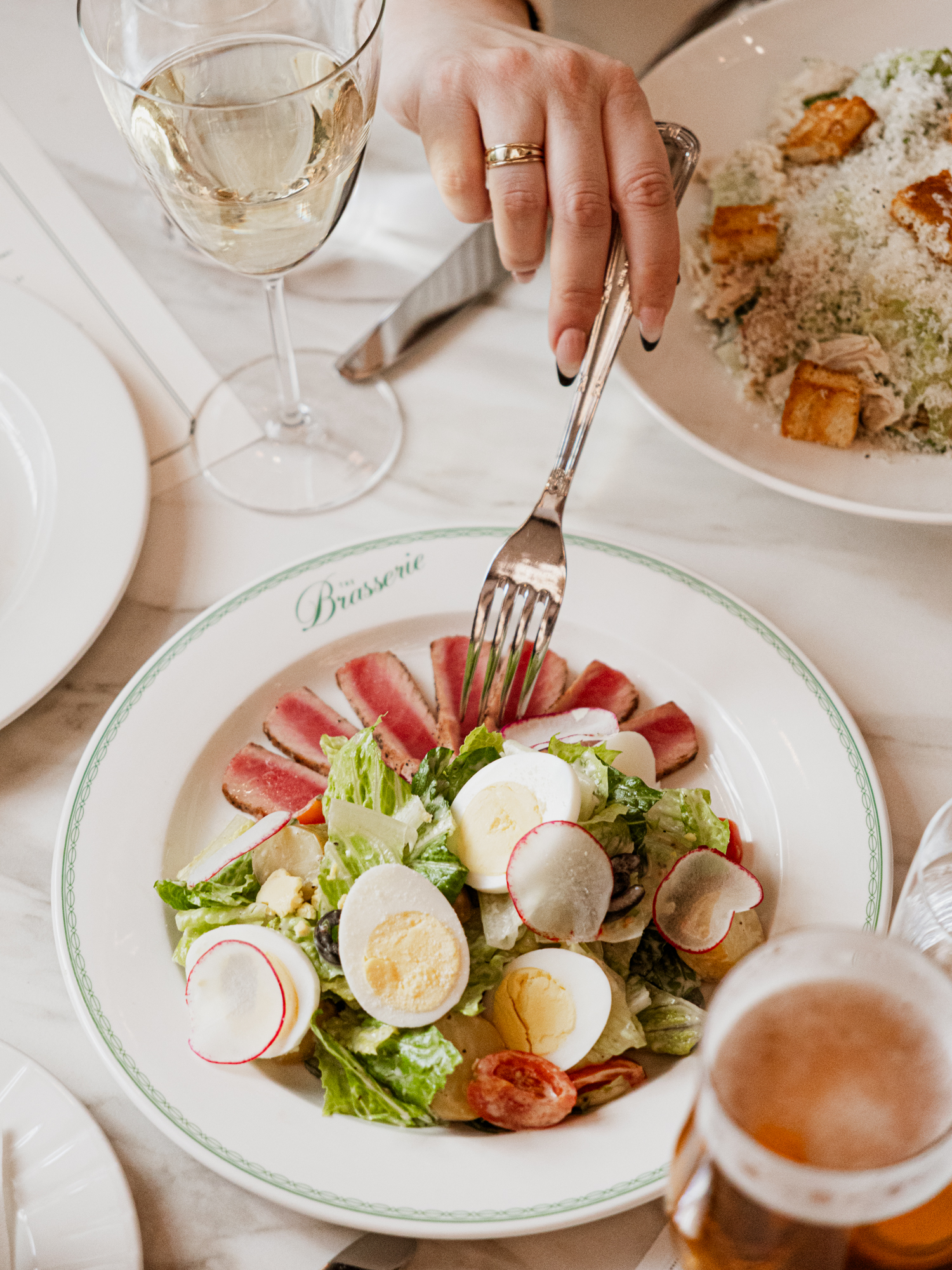 a person eating a salad with a fork