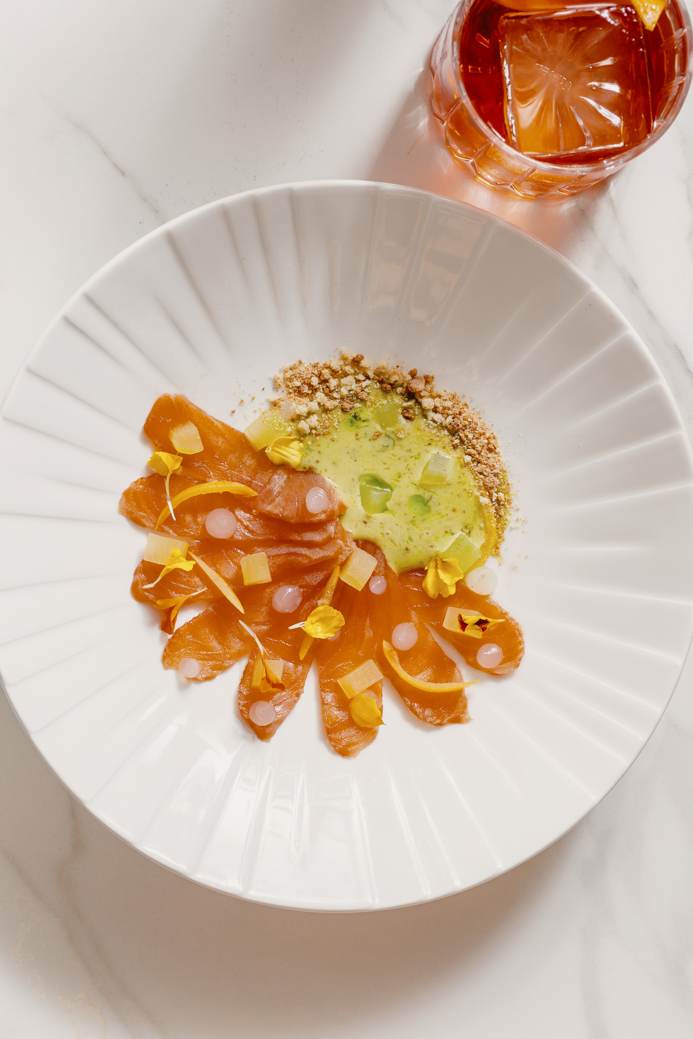 a plate of food on a marble table