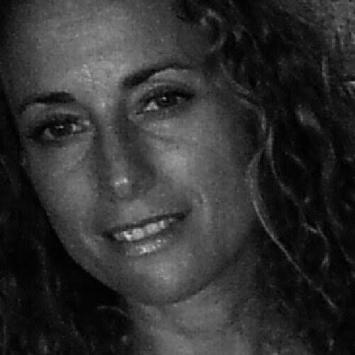a woman who is smiling and looking at the camera