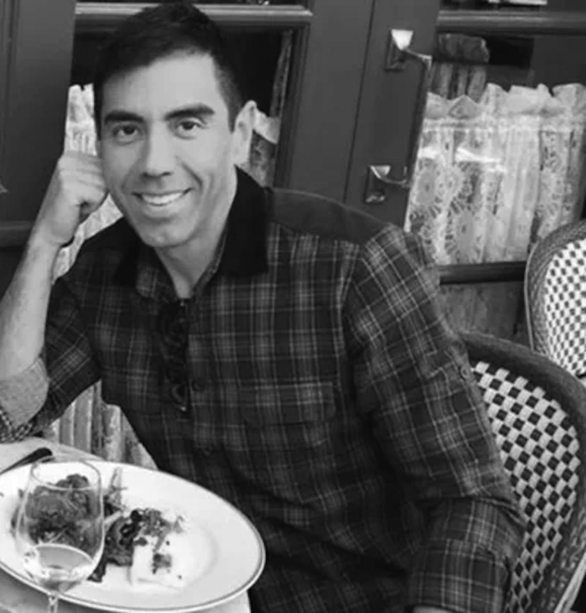 a man sitting at a table in a restaurant