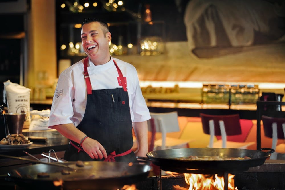 a person cooking food in a restaurant