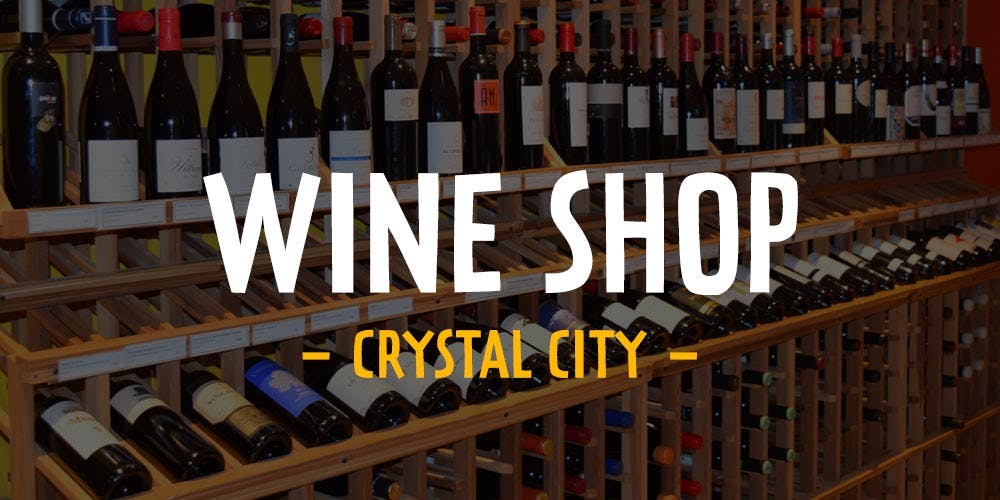 a bottle of wine in front of a store