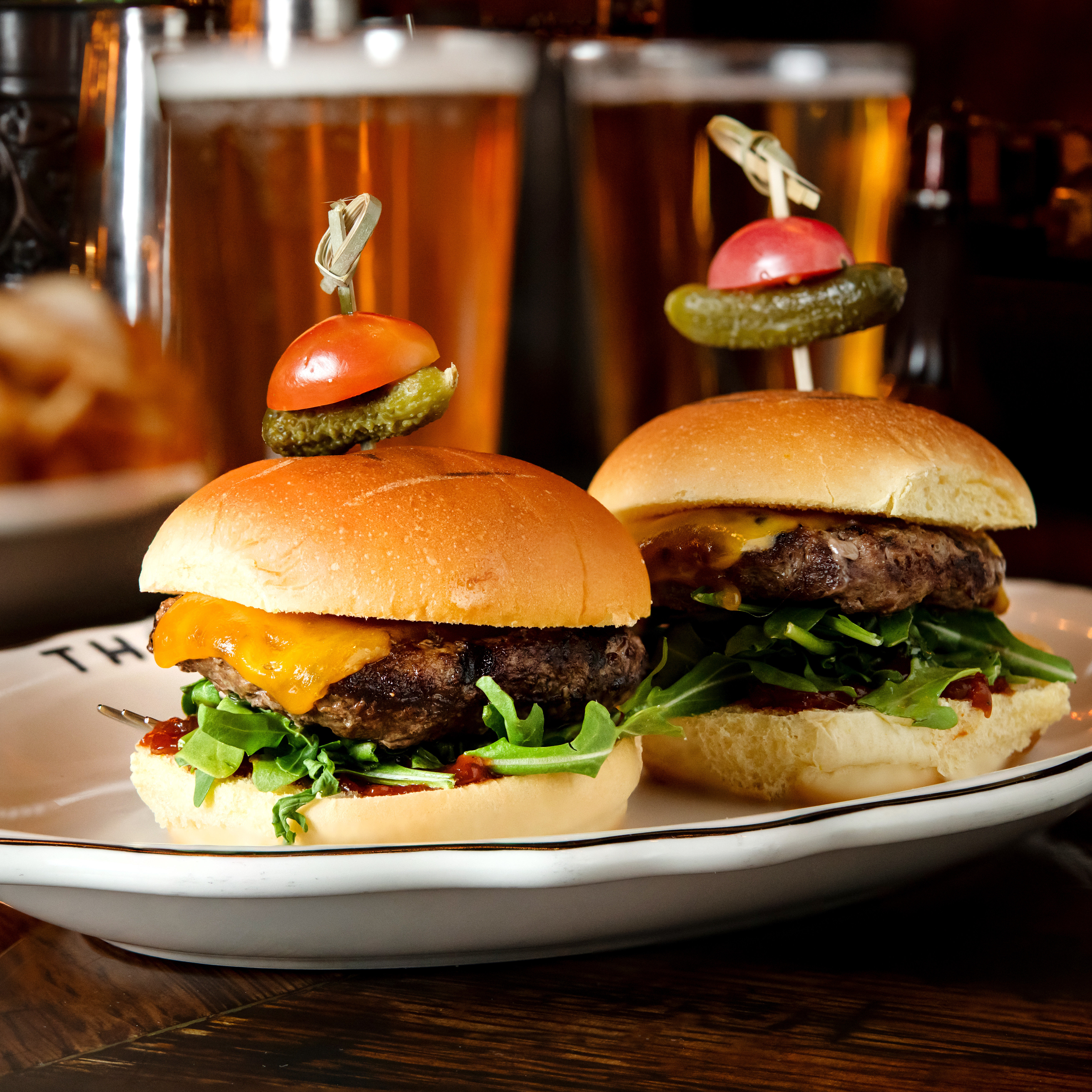 a sandwich sitting on top of a plate of food on a table