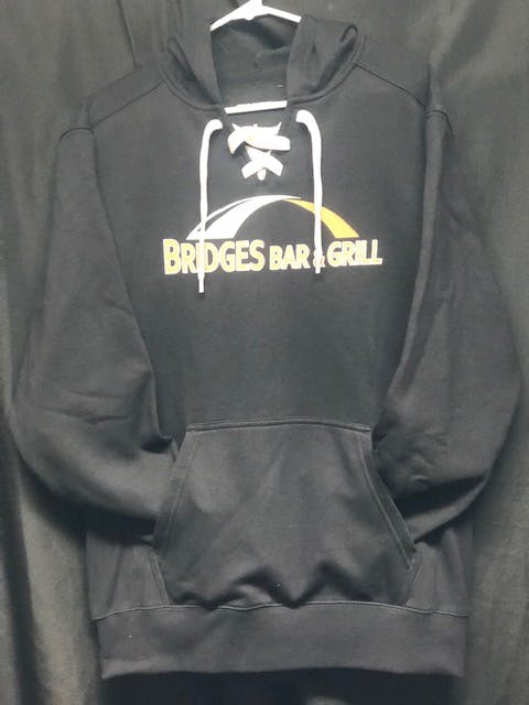 a close up of a black branded hoodie