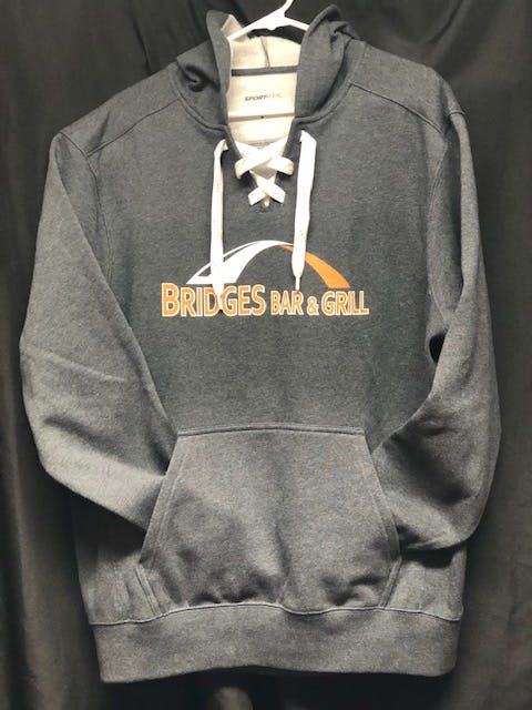 a close up of a gray branded hoodie