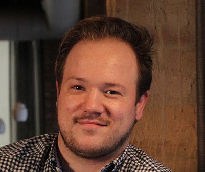 a man smiling for the camera