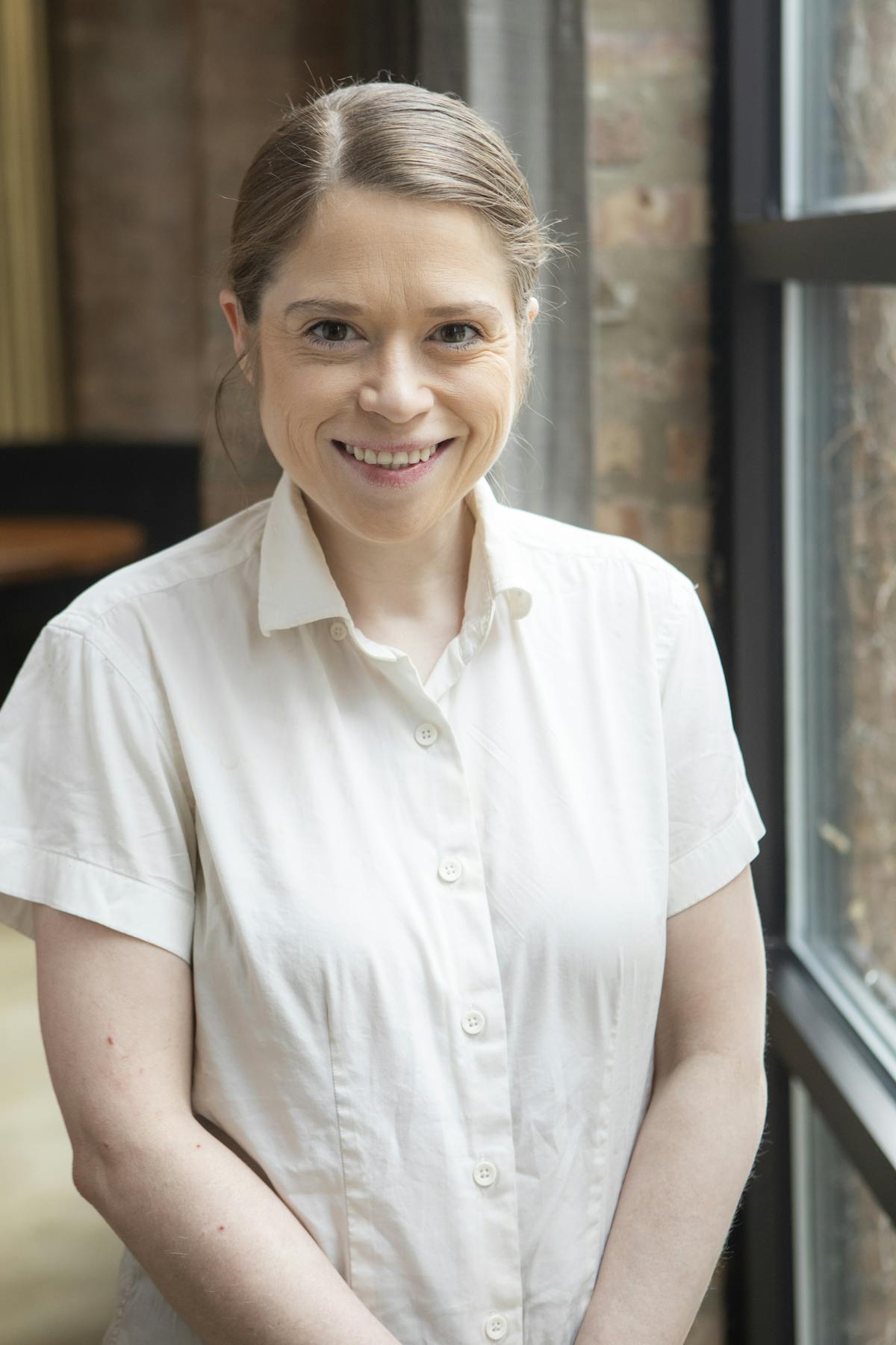 a person standing in front of a window