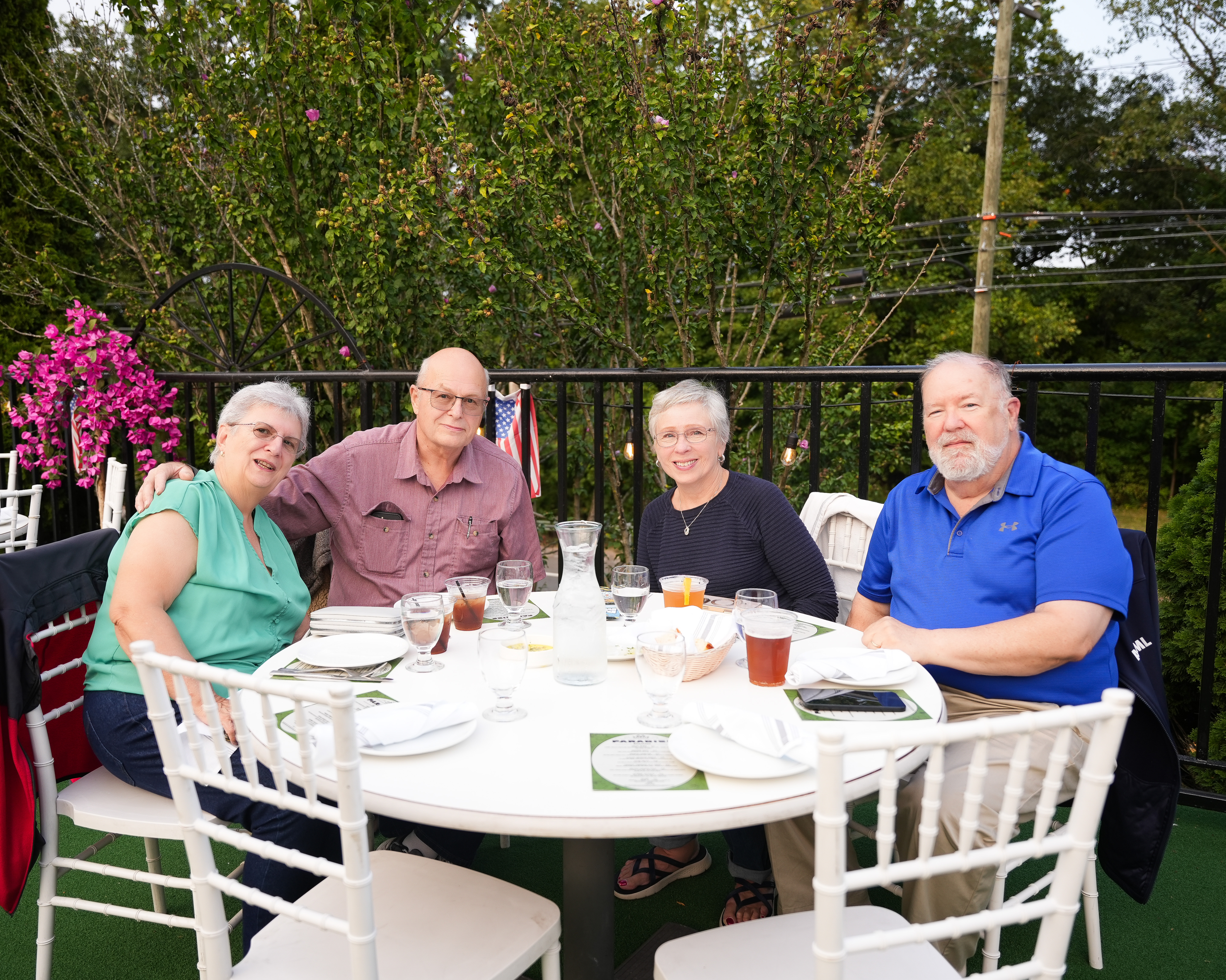 Jeanne Martin et al. sitting at a table eating food