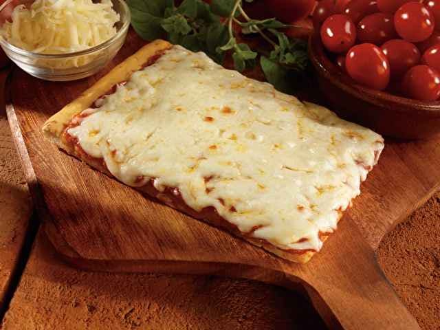 a pizza sitting on top of a wooden cutting board