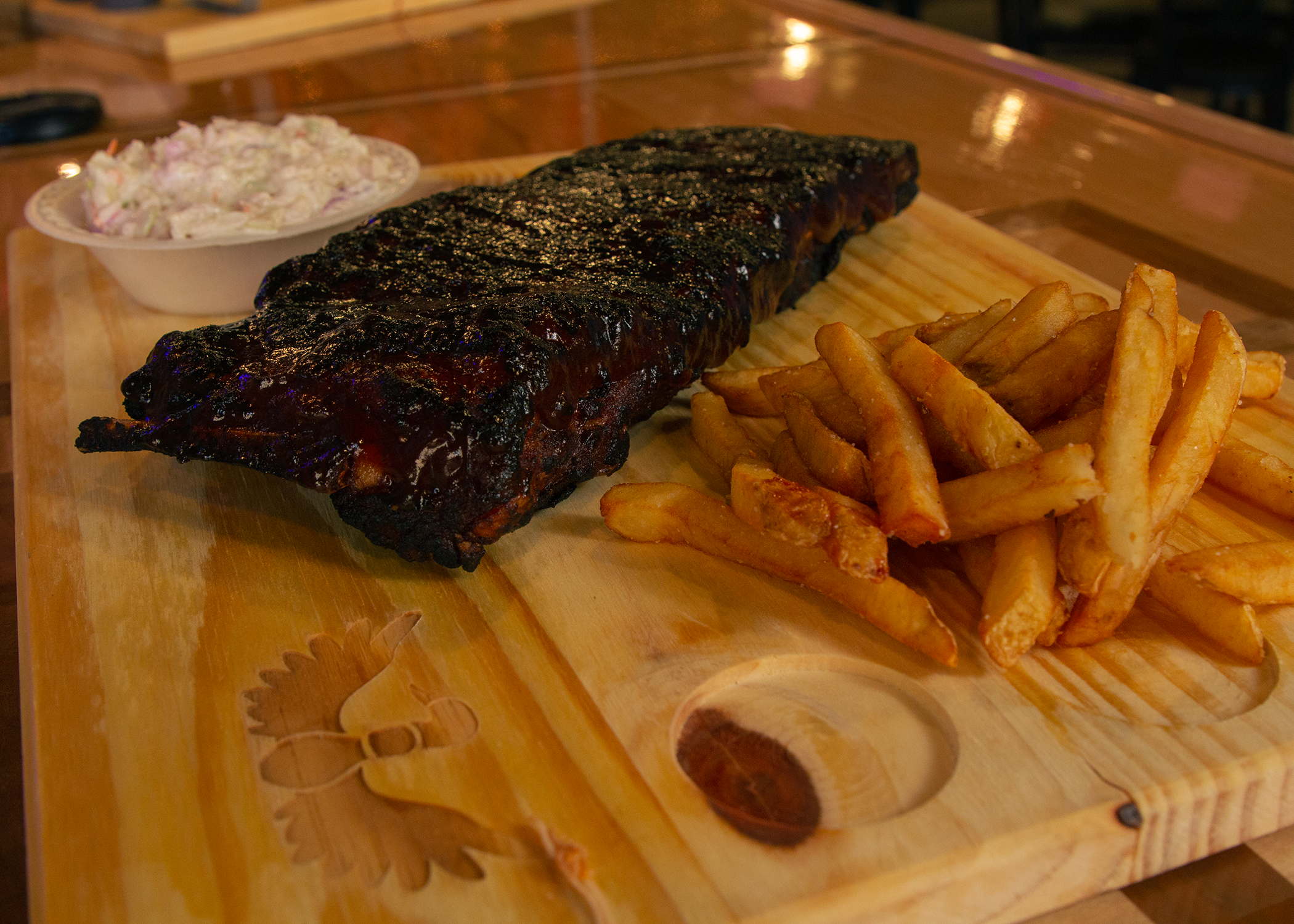 a tray of hot dogs and fries on a table