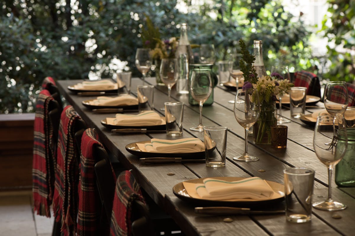 a dining table with wine glasses