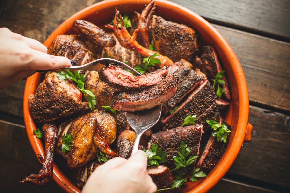 a bowl filled with meat and vegetables