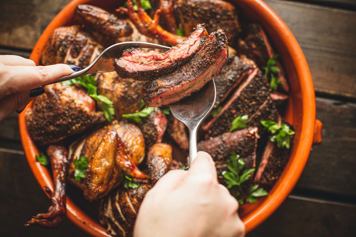 a large bowl with meat 