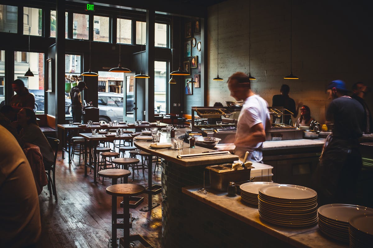 a man in the cooking area of the restaurant