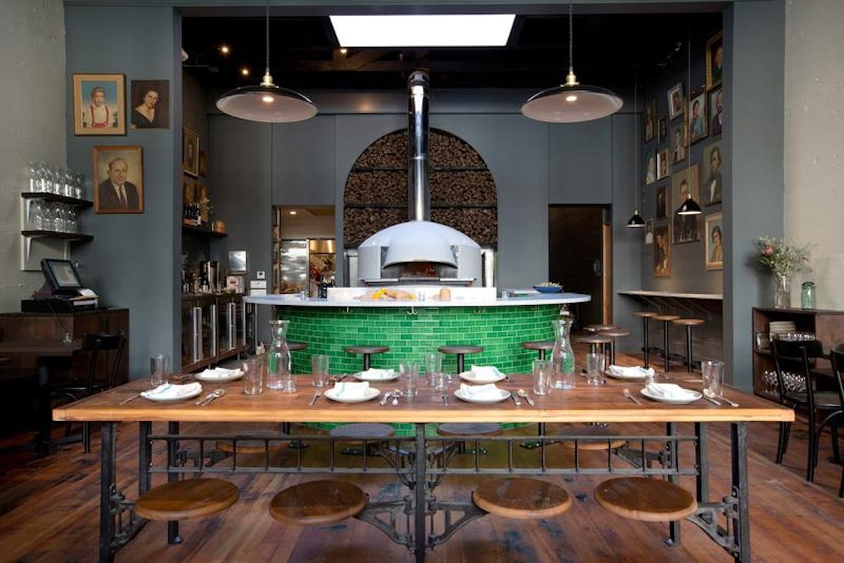 a kitchen with a dining room table