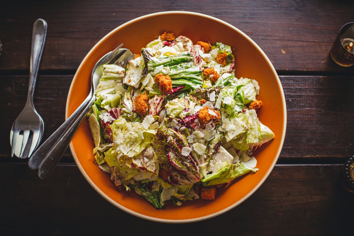 a bowl of salad on a plate