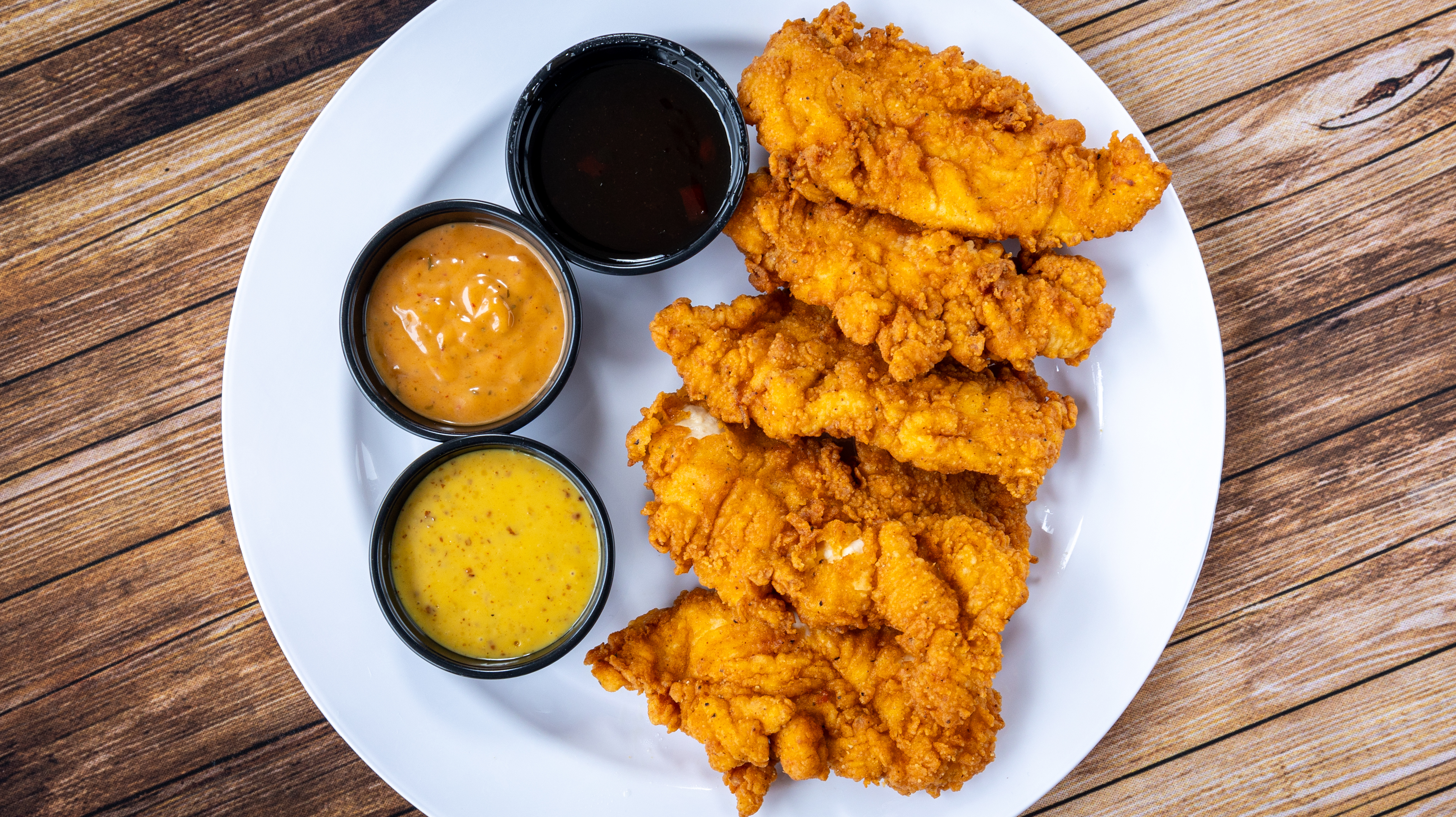 a plate of food on a wooden table