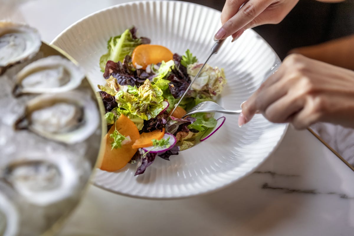 a close up of salad plate