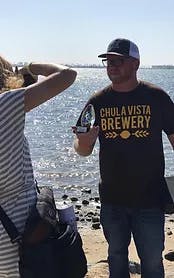 a person standing next to a body of water