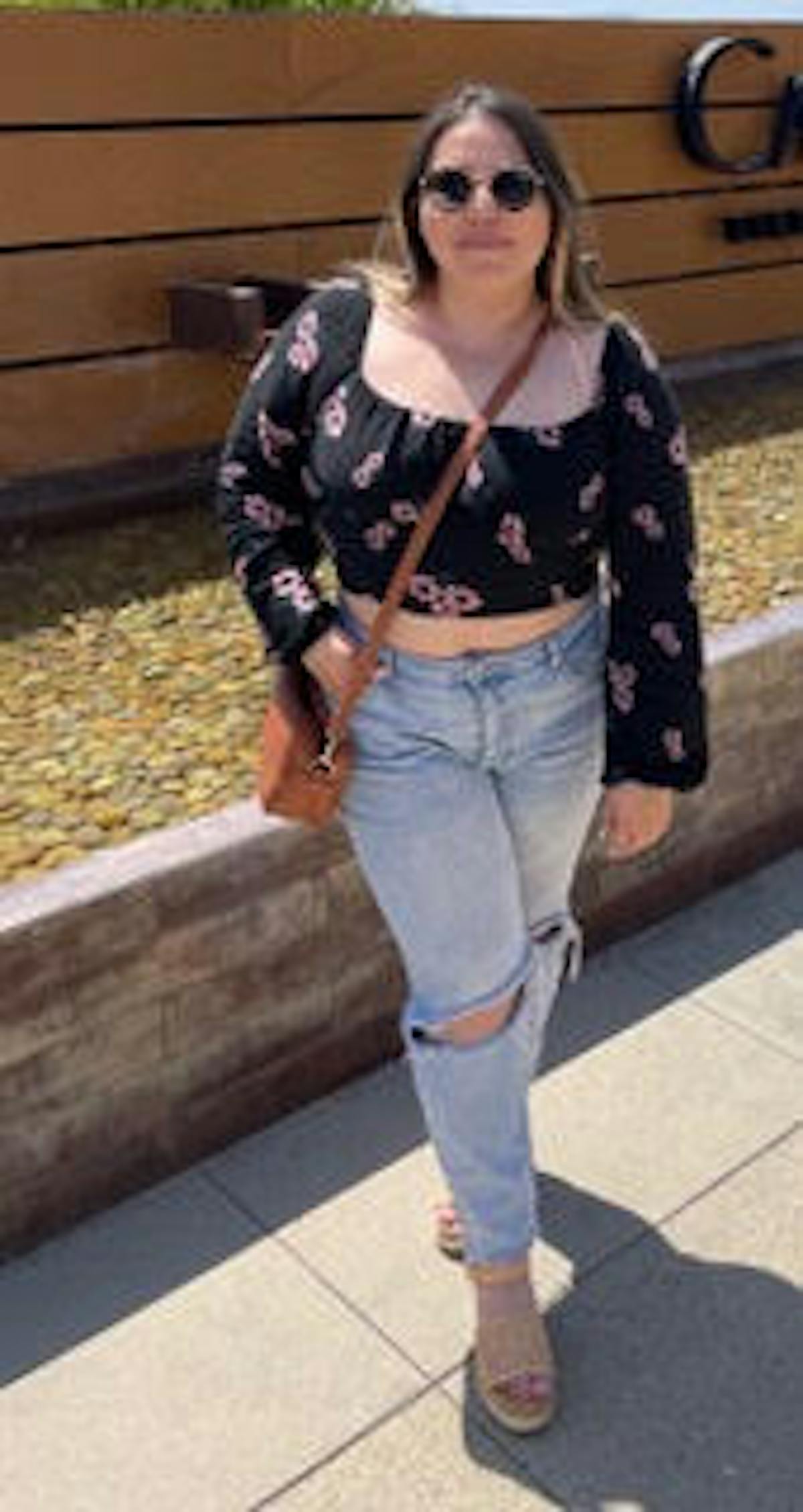 a person standing on a sidewalk