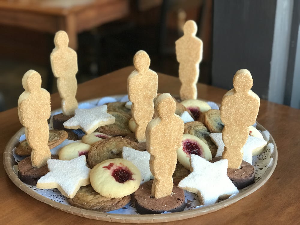 a platter of cookies with award statuettes