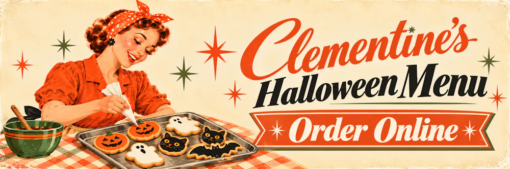 a tray of cookies with cat and ghost on it