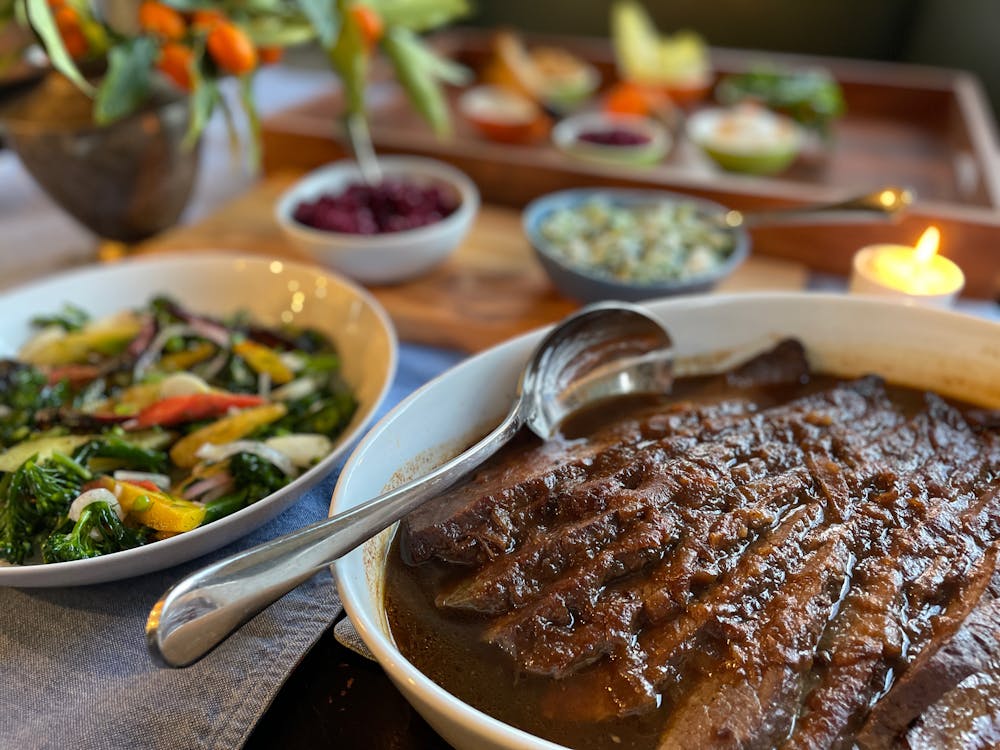 a spread of brisket, vegetables and other sides for Passover