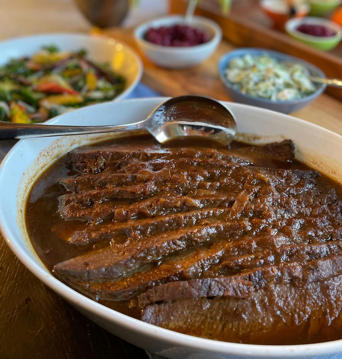 brisket in a white dish