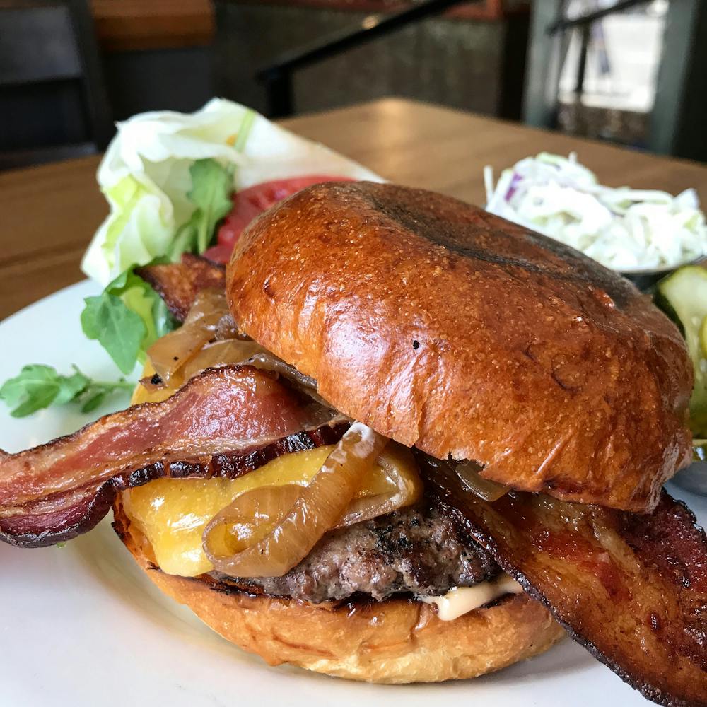 a sandwich sitting on top of a plate of food