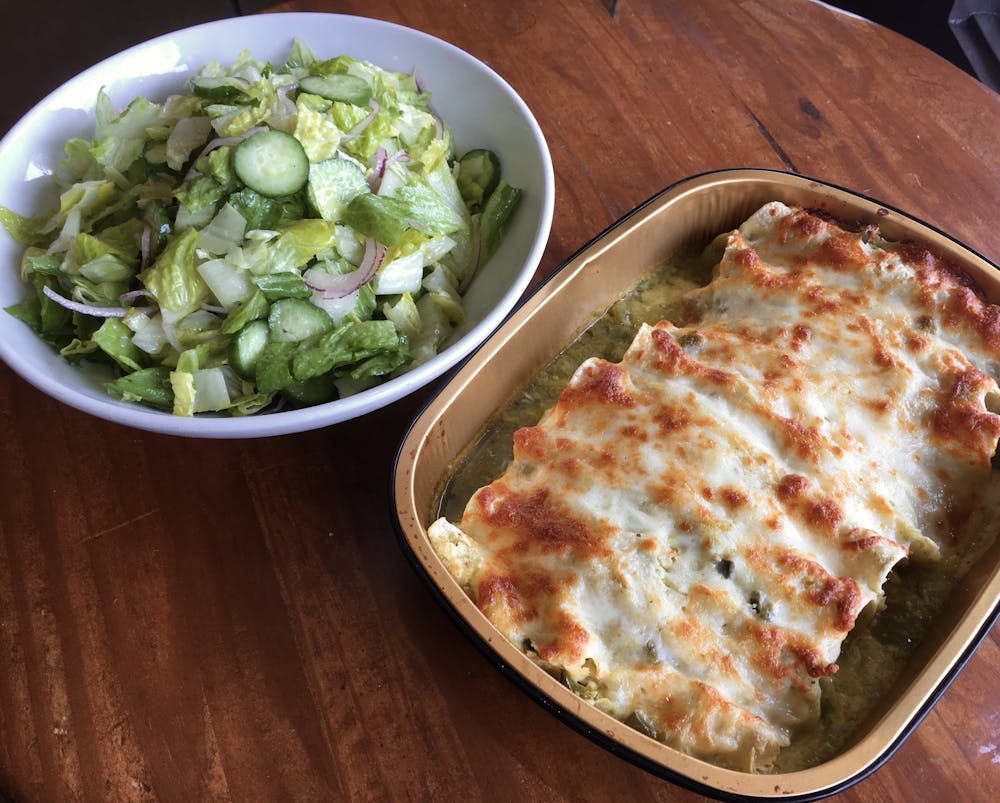 a pizza sitting on top of a plate of food