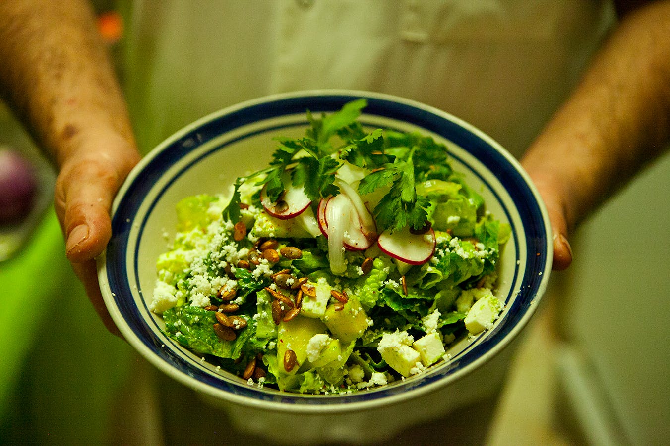 a bowl of food with broccoli