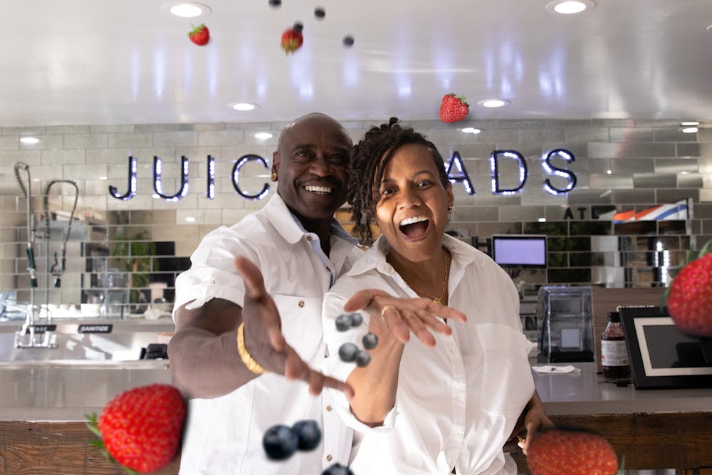 a man and a woman standing in a kitchen