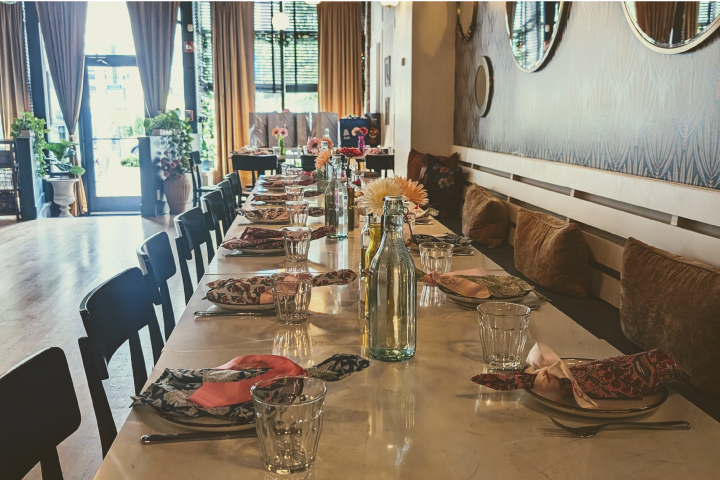 a dining room table in front of a window