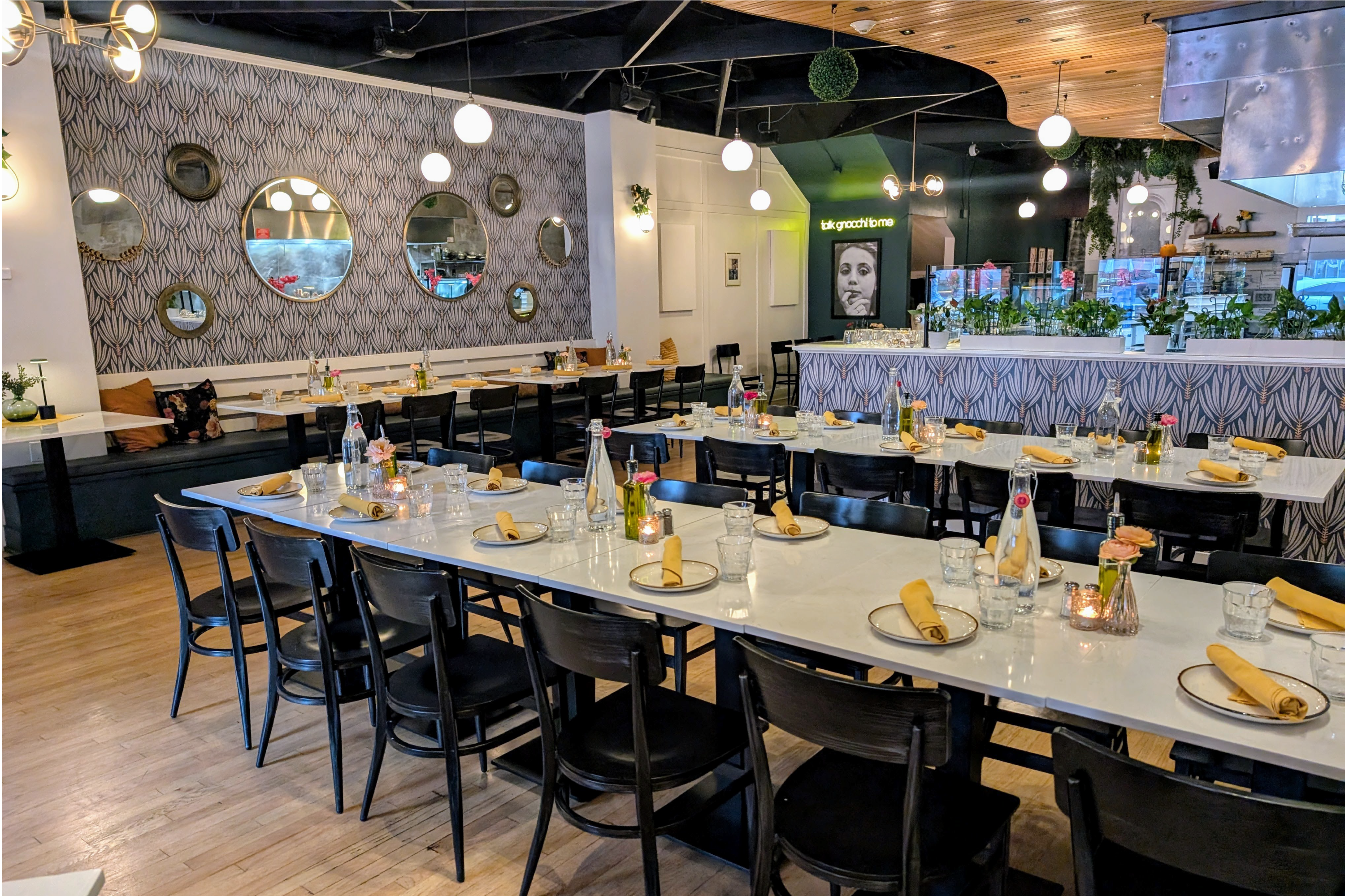 a group of people sitting at a table in a restaurant