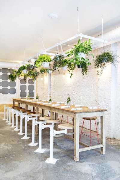 a row of wooden benches sitting on top of a table