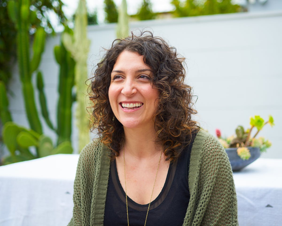 a woman smiling for the camera