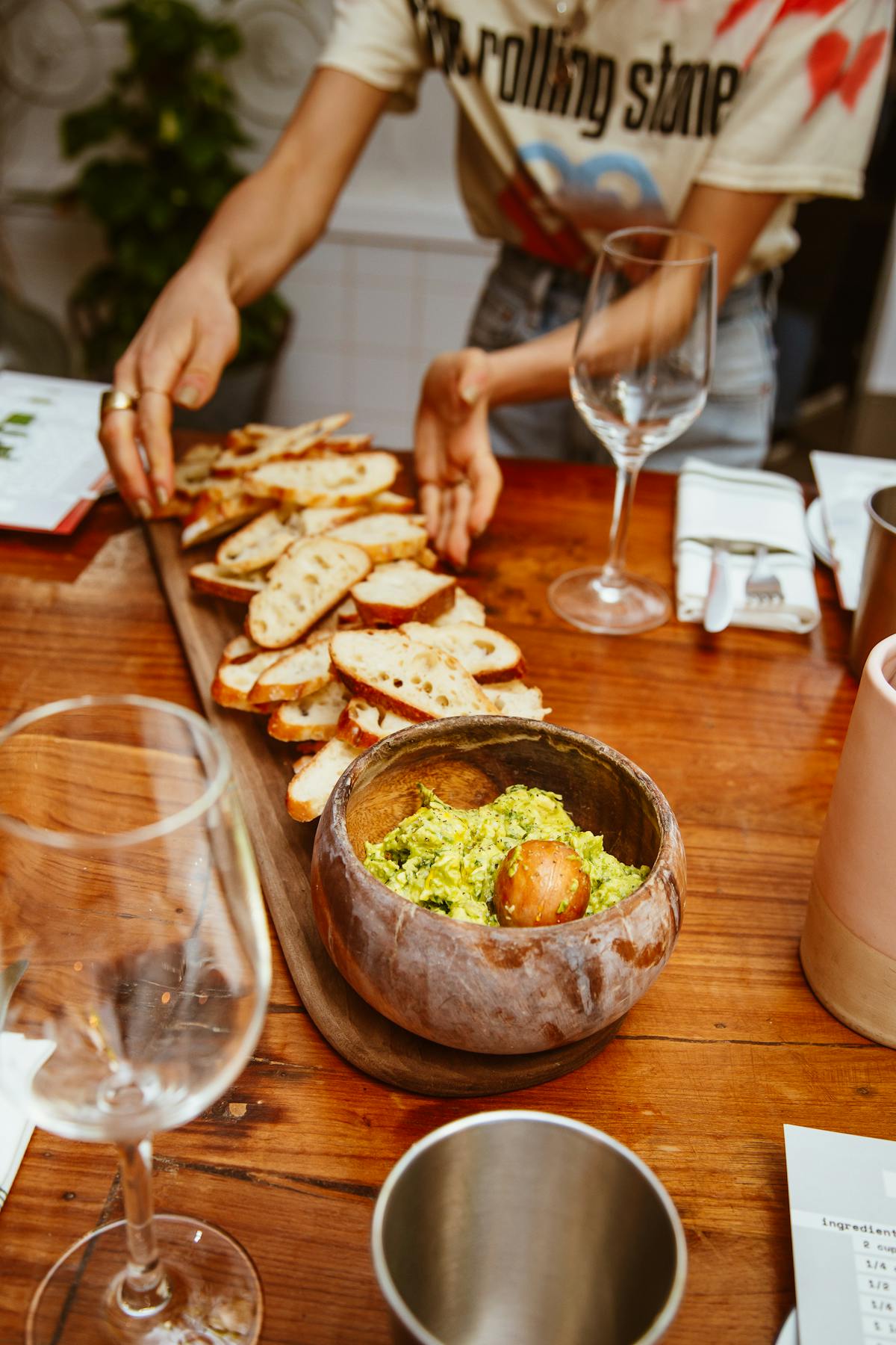 a person sitting at a table with food