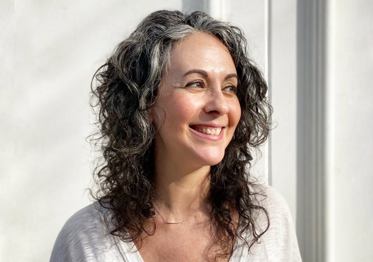 a woman smiling for the camera
