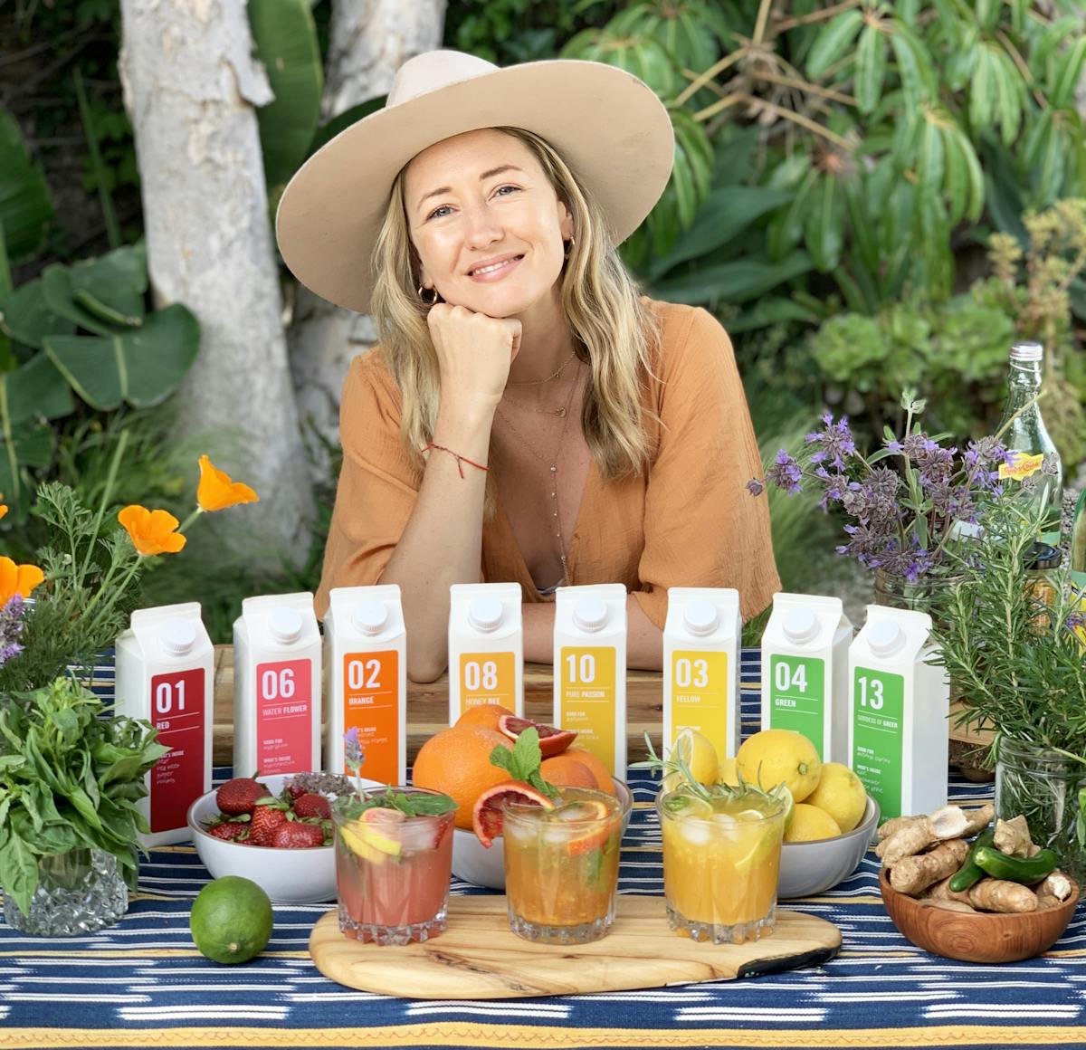 a person sitting at a fruit stand