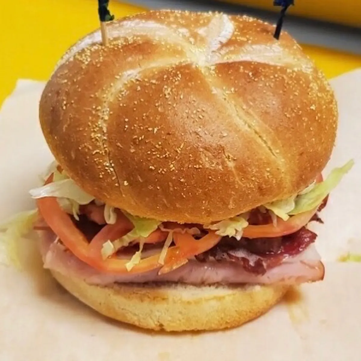 a close up of a sandwich sitting on top of a table
