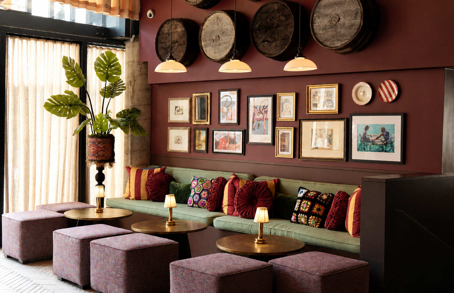 a room with a couch and tables and pictures on the wall