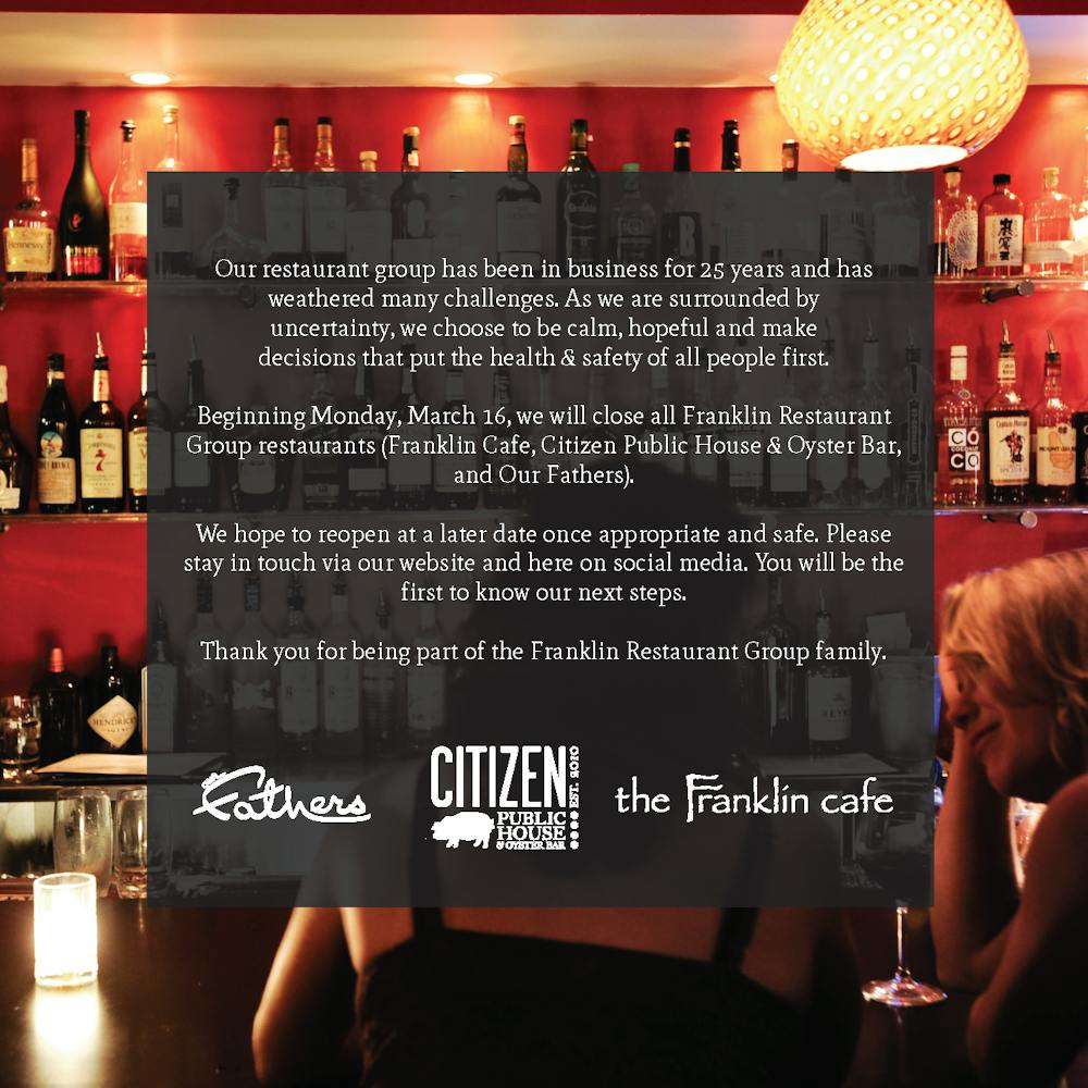 a person sitting at a table in a restaurant