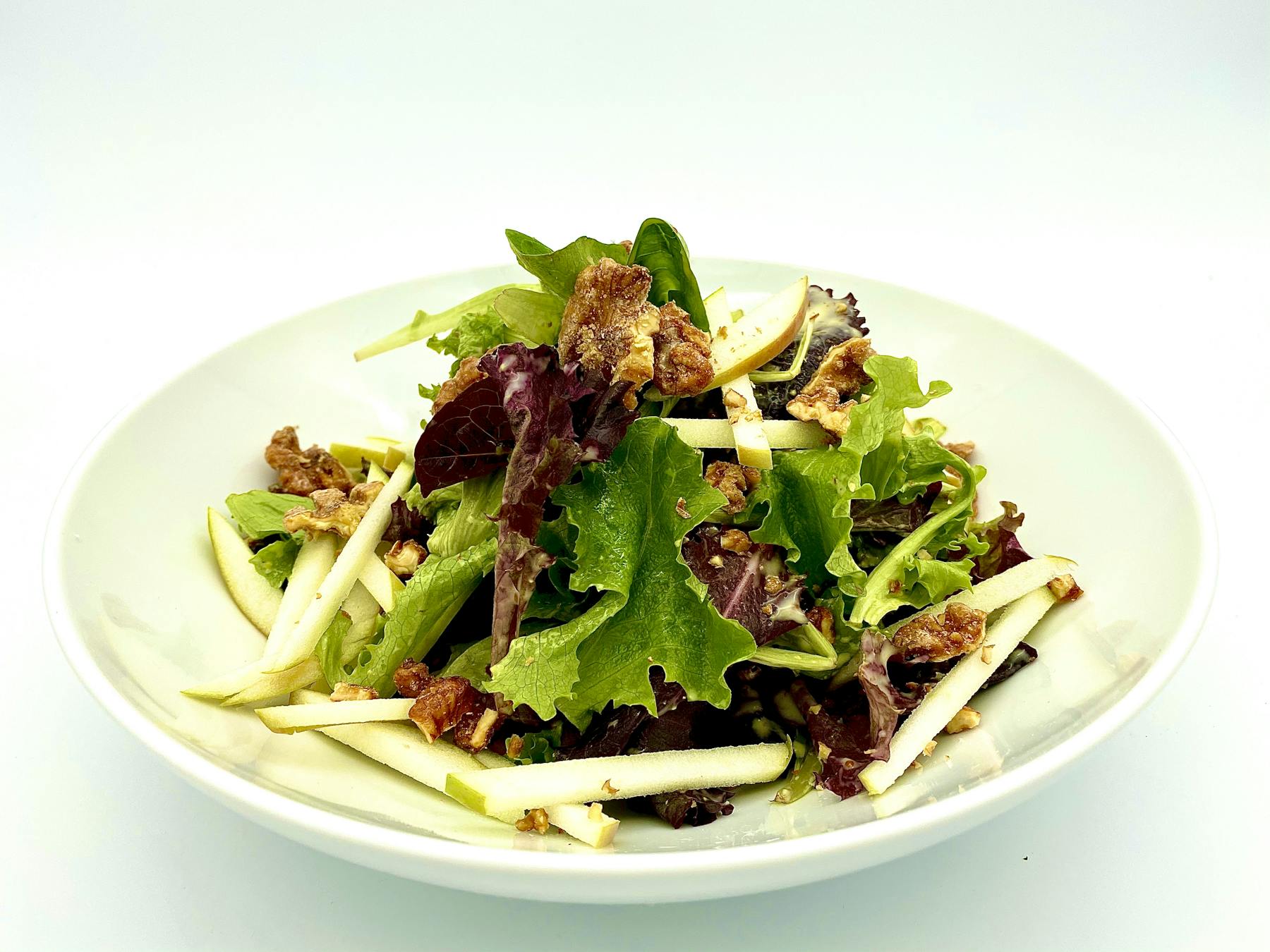 a white plate topped with meat and vegetables