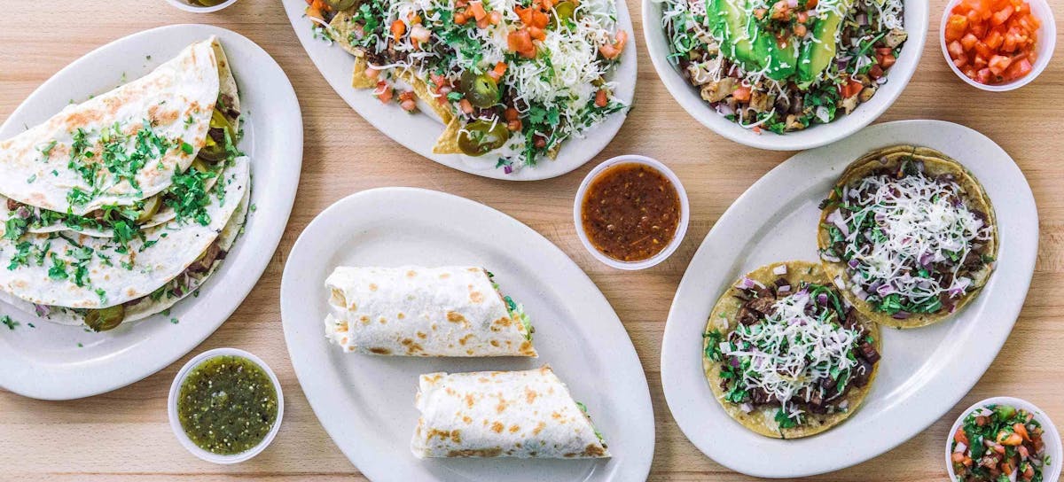 a bowl filled with different types of food on a plate