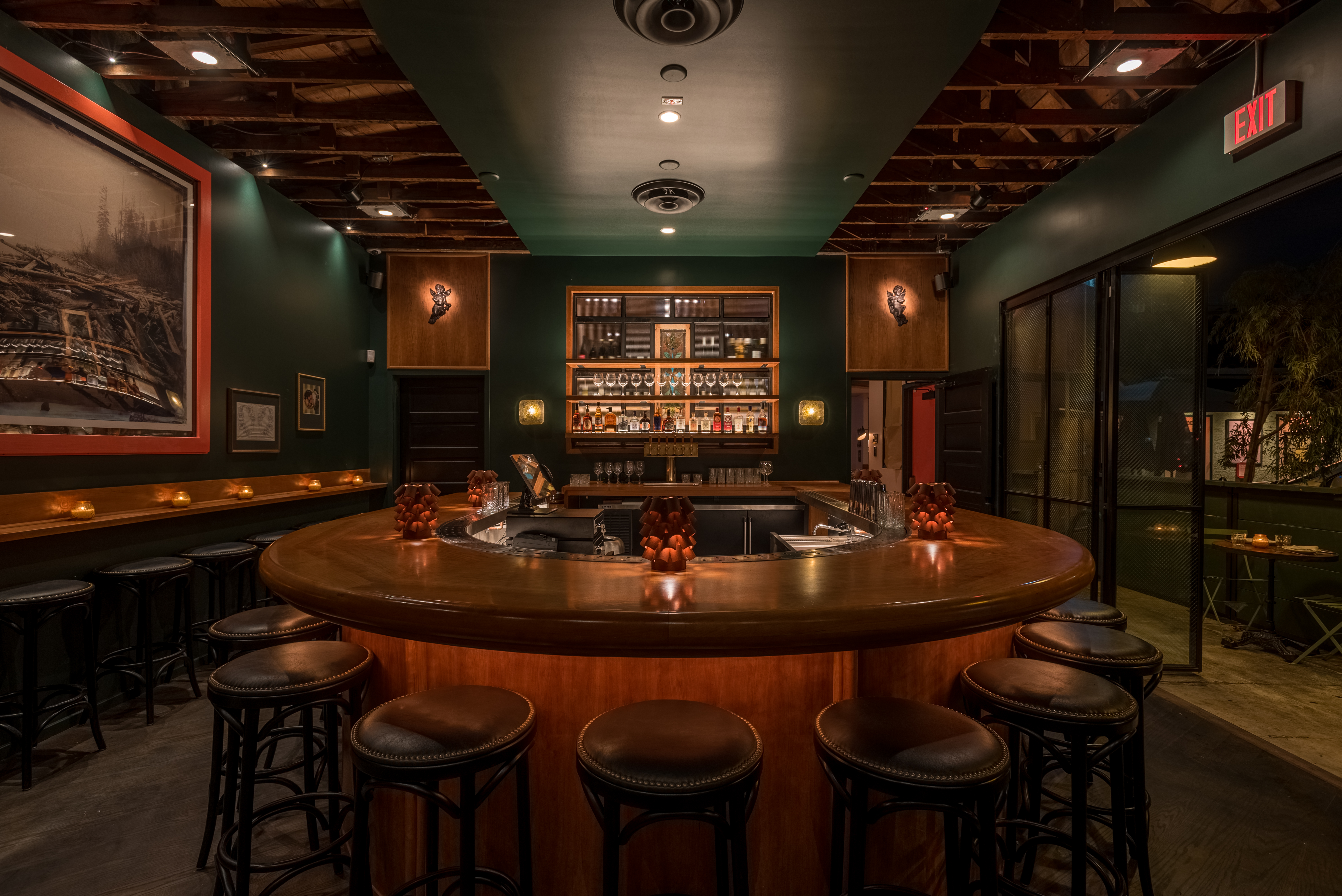 horseshoe bar in dim lighting