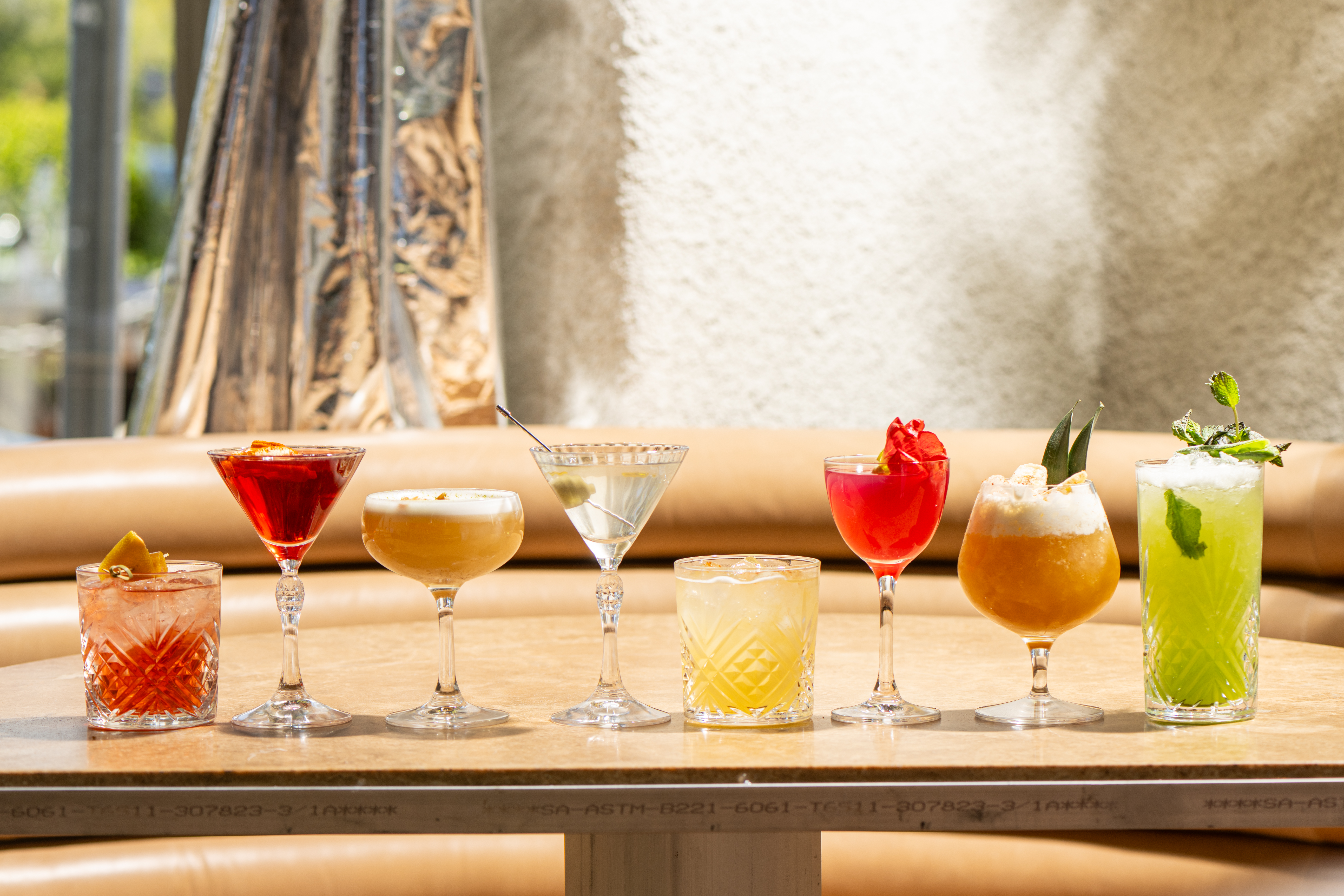 a line up of cocktails