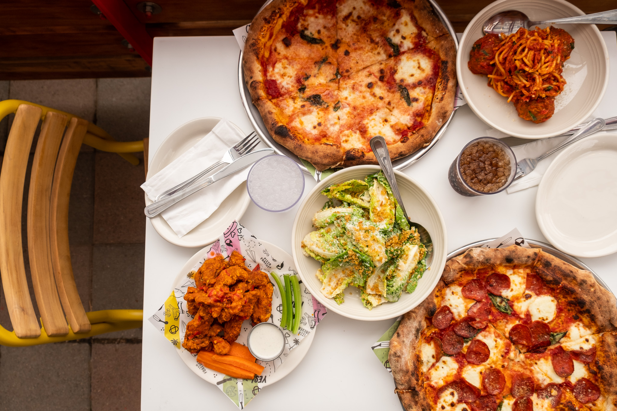 a pizza sitting on top of a plate of food