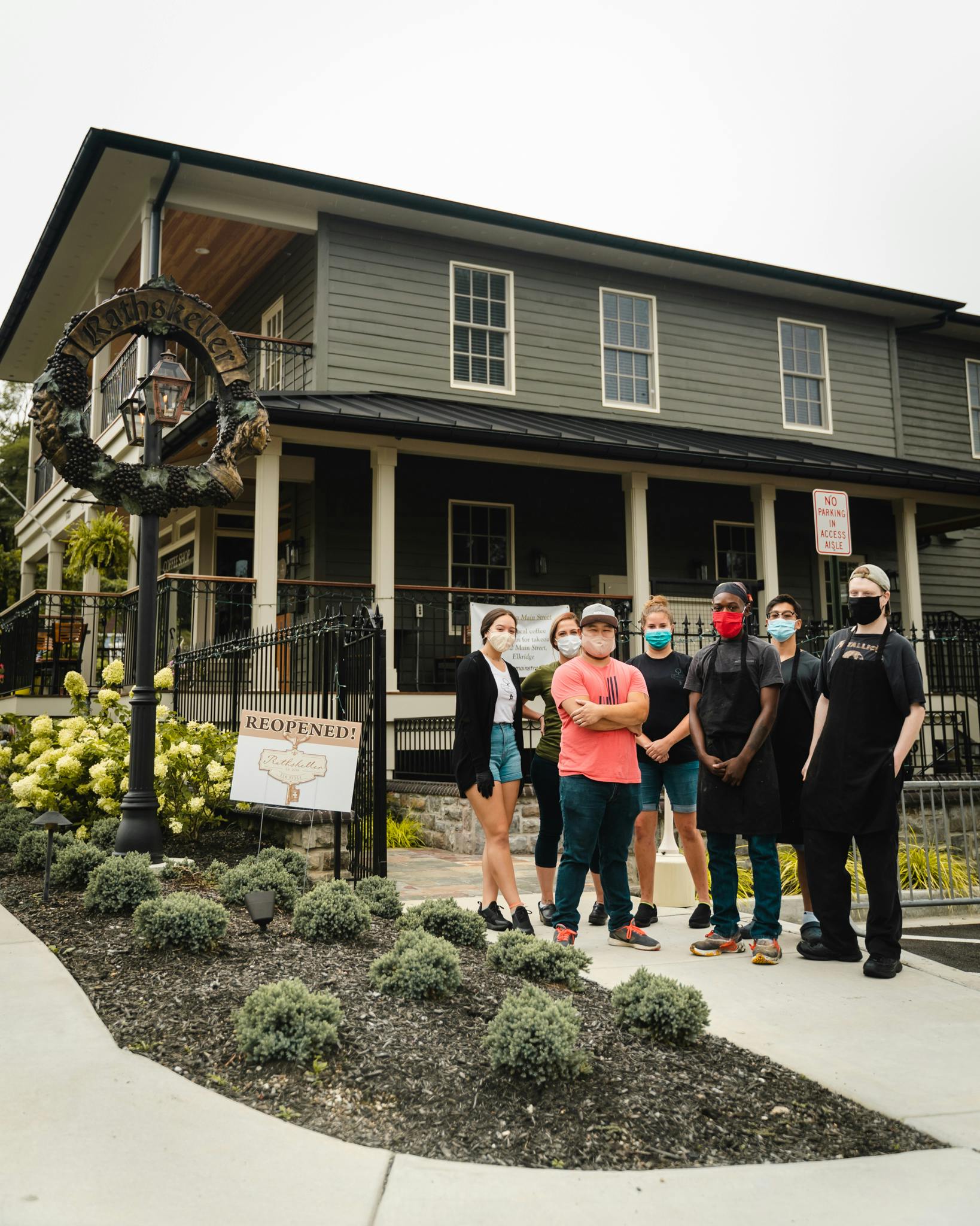 a group of people standing in front of a building